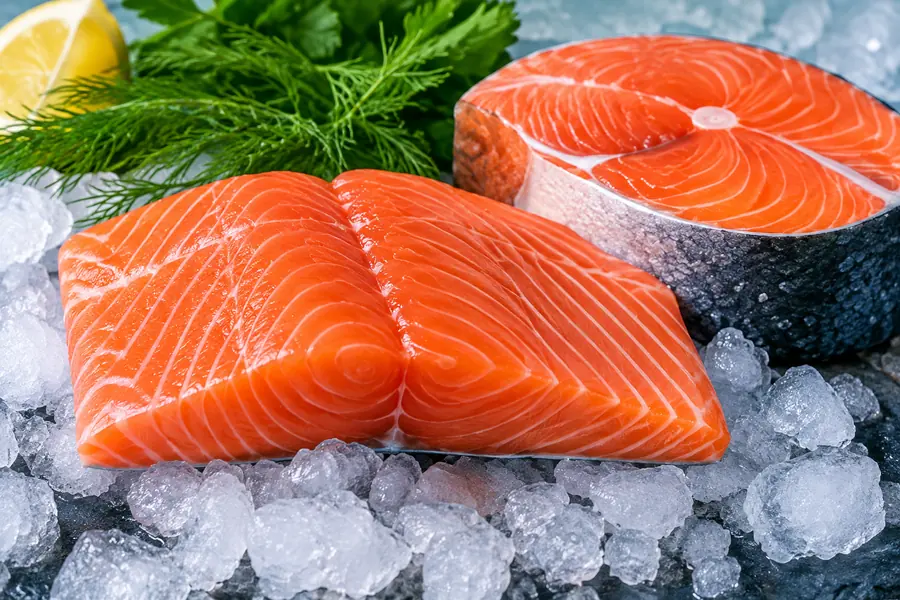 Fresh Atlantic salmon fillets displayed on ice for wholesale seafood buyers